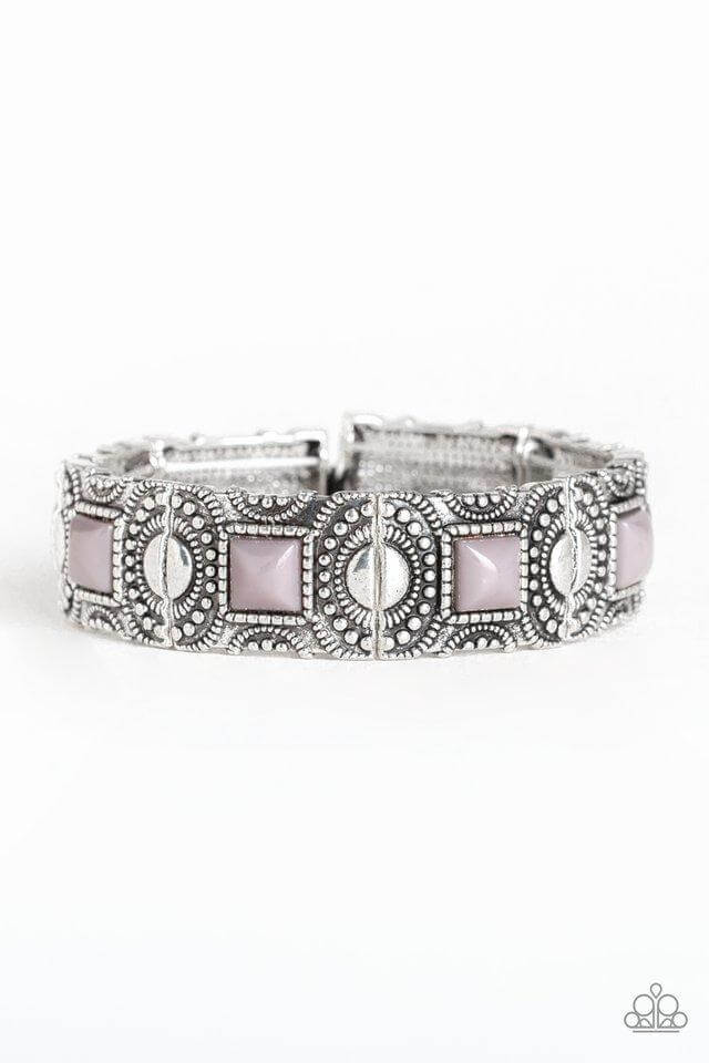 Elegant silver tribal trailblazer bracelet featuring intricate designs and pink accents.