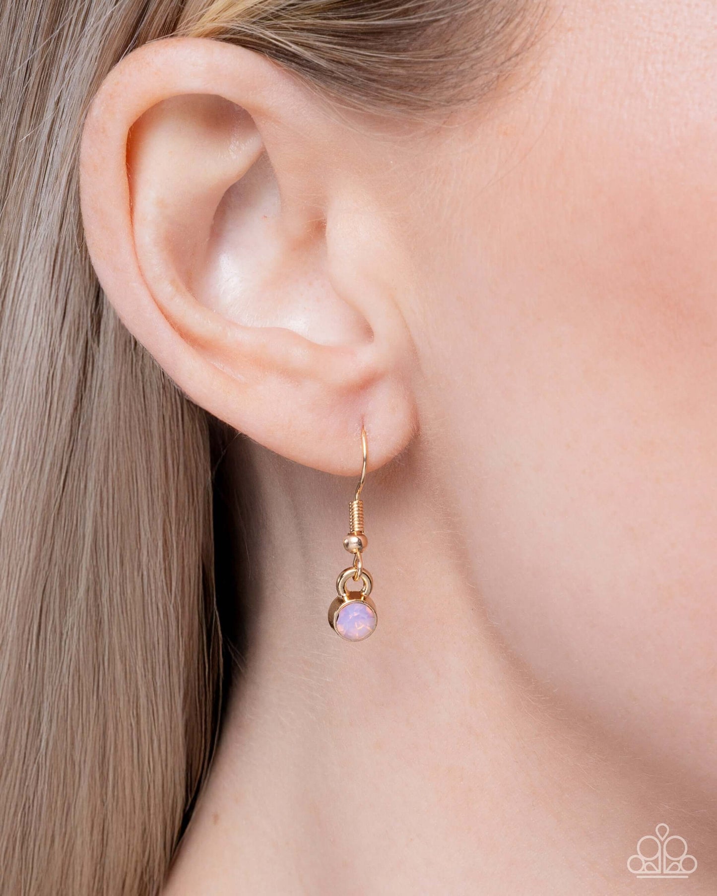 Rustic Relaxation - Gold Paparazzi Necklace showcased on model wearing gold earrings.