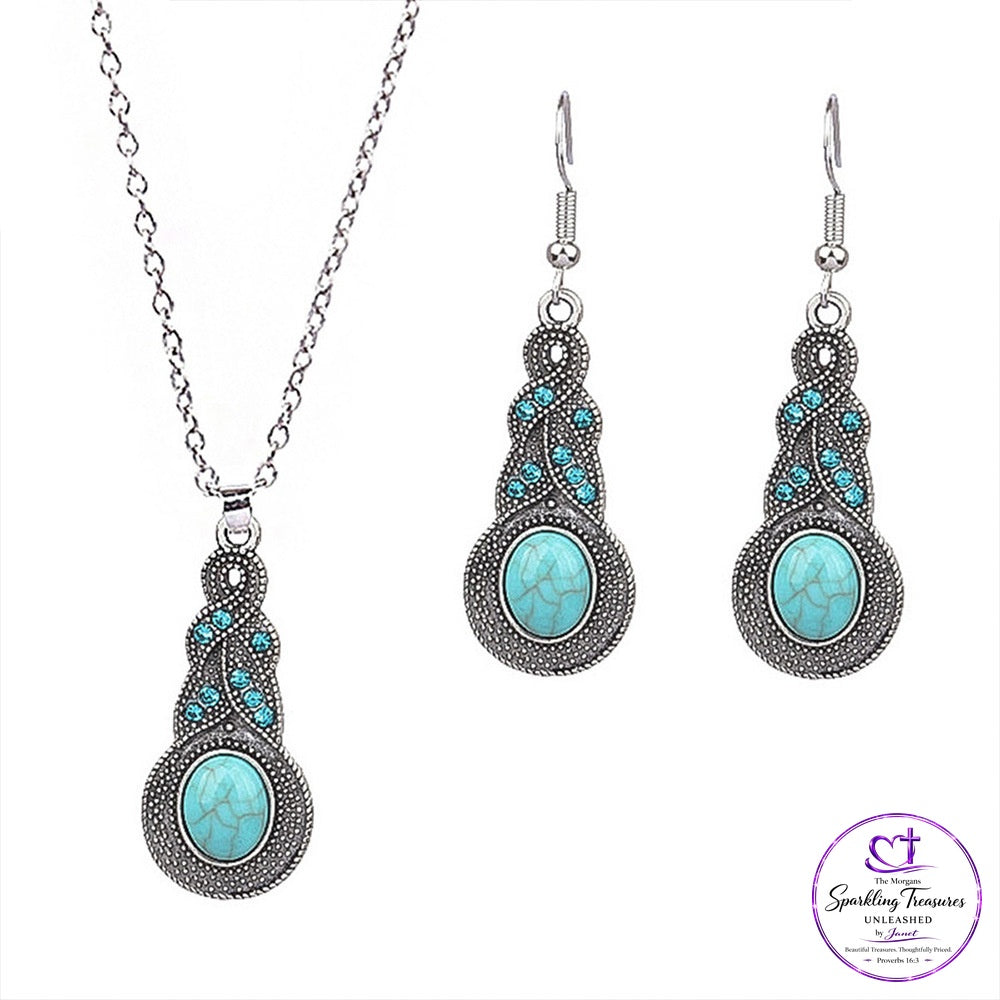 Silver-tone jewelry set featuring a necklace and matching drop earrings with oval turquoise-colored centers and small turquoise accents, shown on a white background with a Sparkling Treasures by Jennifer logo in the bottom right corner.