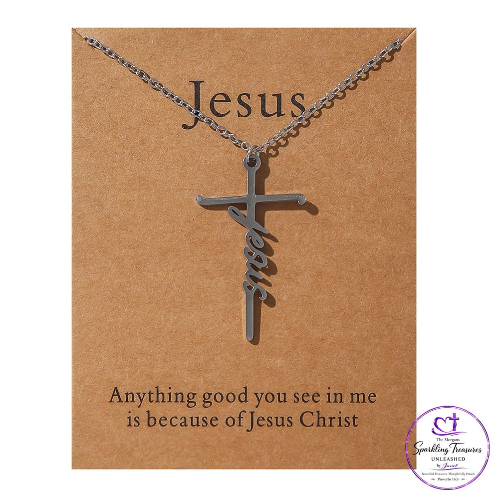 A silver cross pendant necklace with the word 'Jesus' written in cursive, displayed on a brown kraft card that reads 'Jesus' and 'Anything good you see in me is because of Jesus Christ'.
