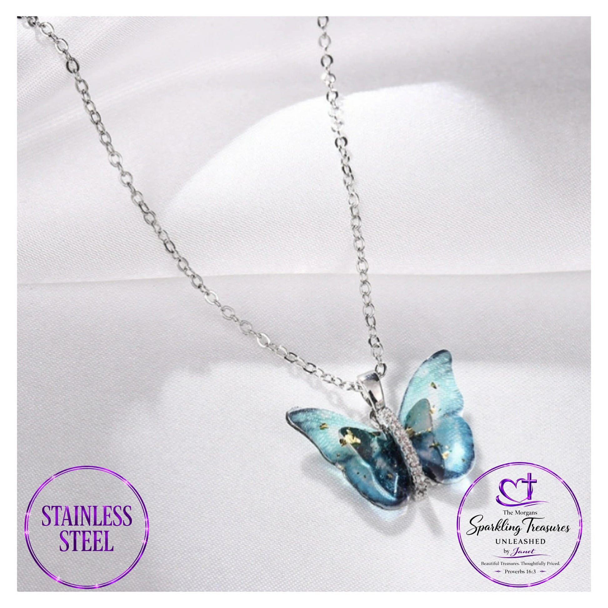 Butterfly pendant necklace on a white background with 'Stainless Steel' and 'Sparkling Treasures' branding.
