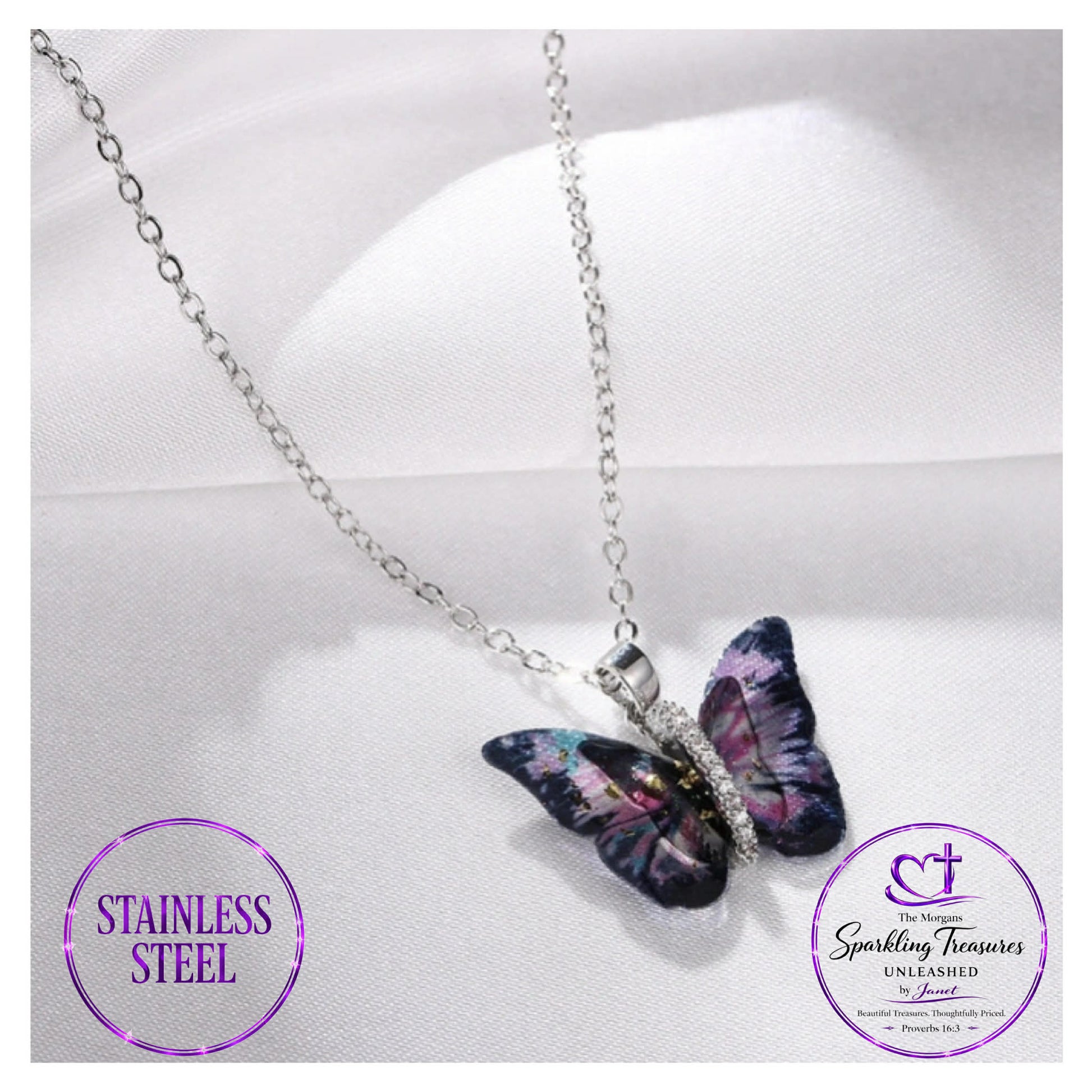 Butterfly necklace on a white cushion with 'Stainless Steel' label