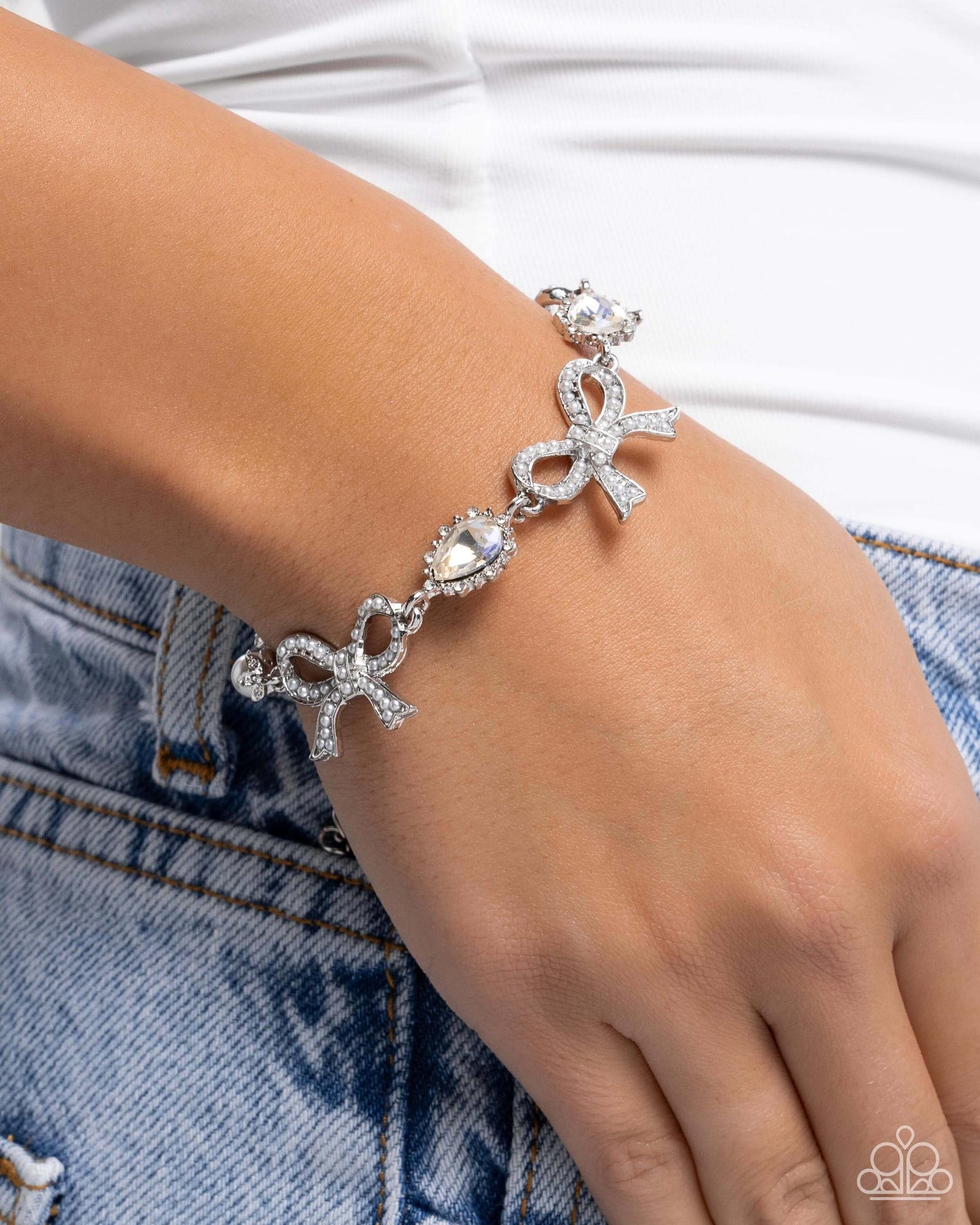 Coquette Caliber - White Paparazzi Bow Bracelet Accessories,Bow,Bracelet,Iridescence,Silver,Silver Accents,White,White rhinestones