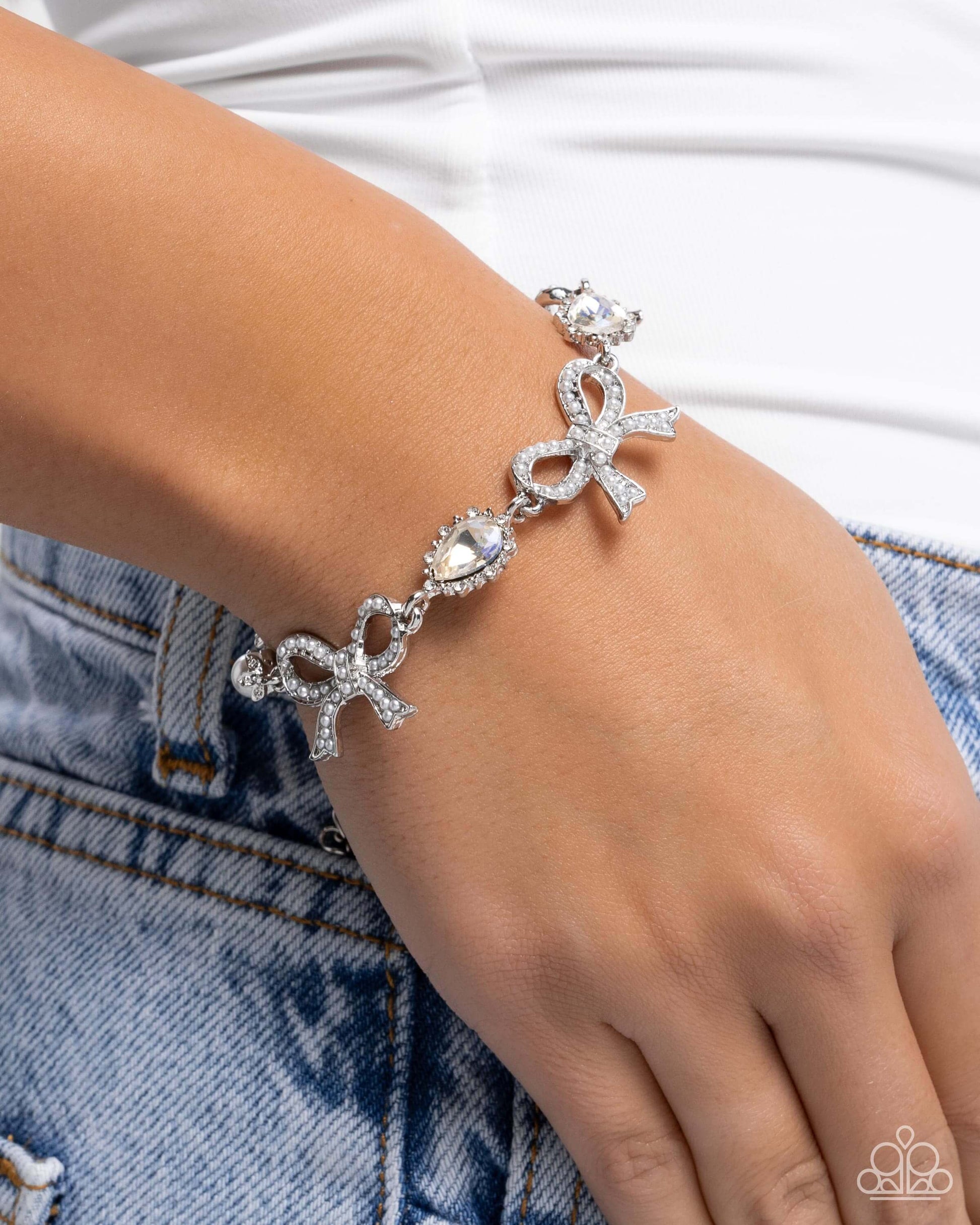 Coquette Caliber - White Paparazzi Bow Bracelet Accessories,Bow,Bracelet,Iridescence,Silver,Silver Accents,White,White rhinestones