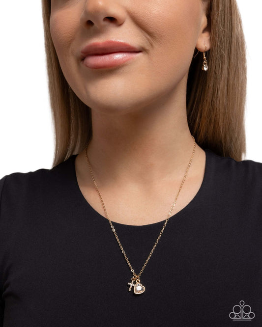 Blessed Brilliance - Gold Paparazzi Cross Necklace Accessories,Cross,Gold,Hearts,Necklace,Short Necklace