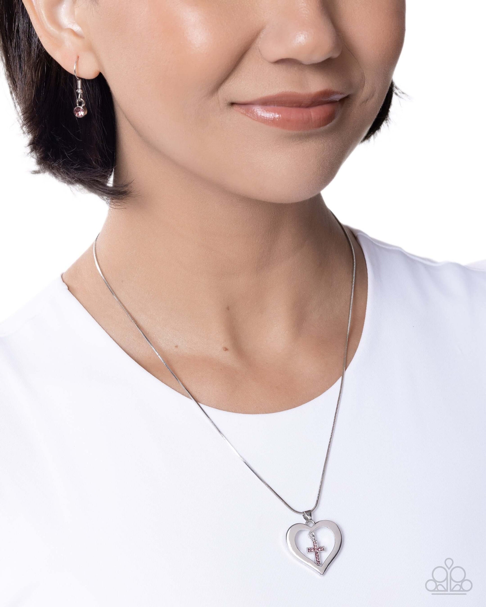 Model wearing Heavenly Honor - Purple Amethyst Cross Heart Necklace and matching earrings with silver accents.