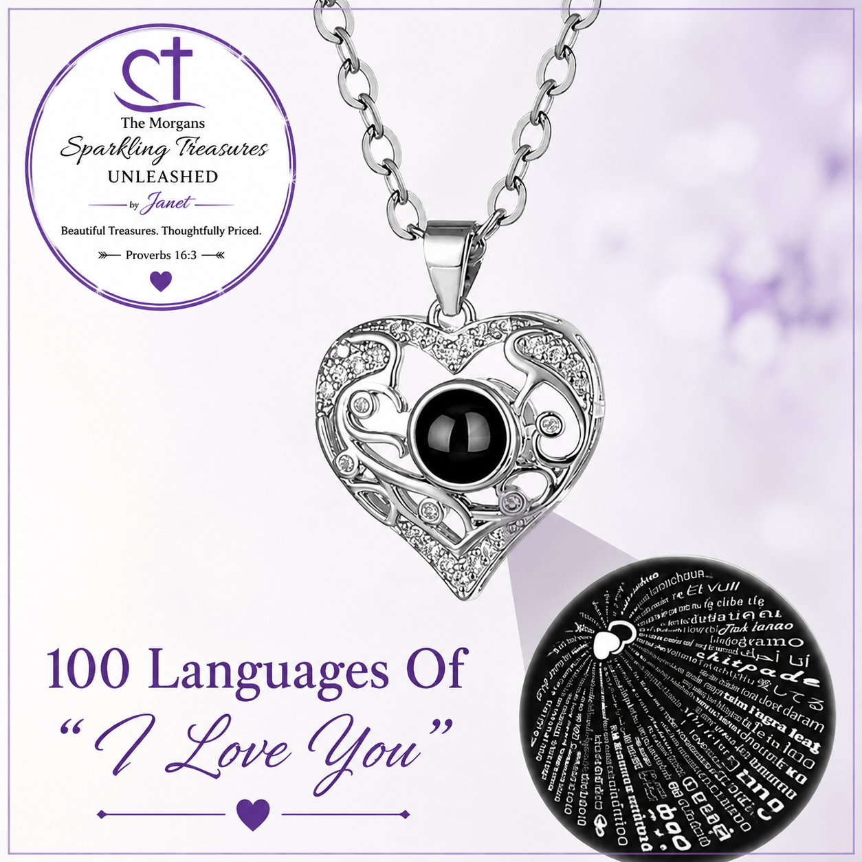 Silver heart-shaped pendant necklace with a black center stone and engraved filigree, shown on a chain against a light purple background. The image includes branding for The Morgans Sparkling Treasures Unleashed and a circular inset displaying engraved text in multiple languages.