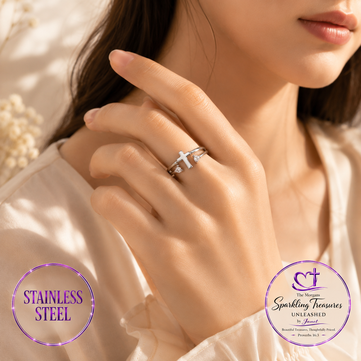 Close-up of a hand wearing a silver ring with 'Stainless Steel' text and brand logo.