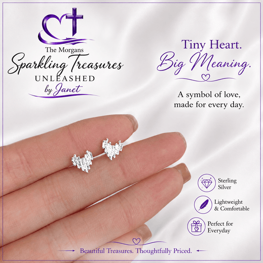 Silver heart-shaped earrings on a hand with promotional text about 'The Morgans Sparkling Treasures Unleashed by Janet'.