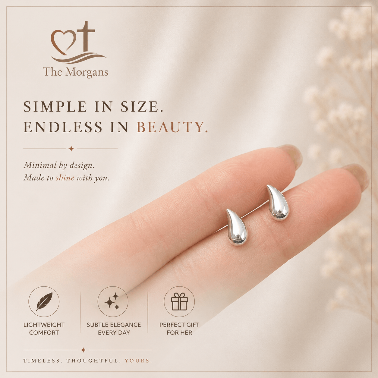 Silver earrings on a finger with 'The Morgans' branding and product features.