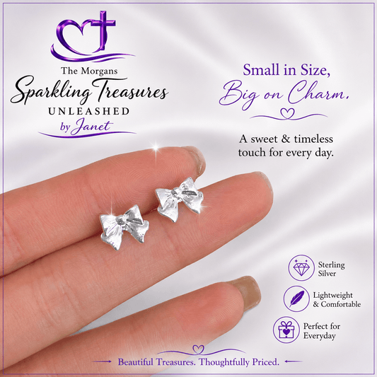 Silver bow earrings on a hand with 'The Morgans Sparkling Treasures' branding.